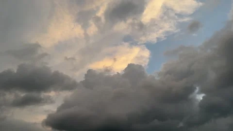 Dramatic Dark Storm Clouds Moving Across Blue Sky Time Lapse Stock Footage 345288849