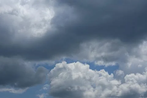 Dramatic Dark Storm Clouds Over Blue Sky 写真素材
