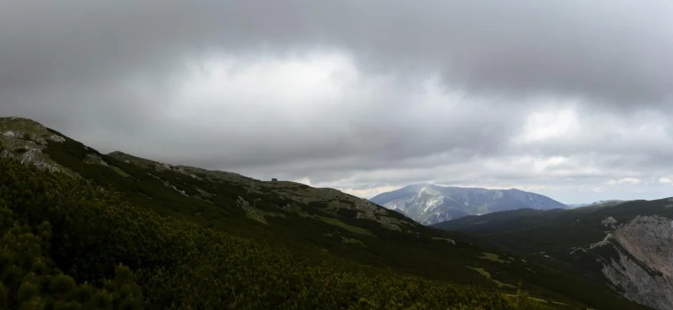 Dramatic Dark Storm Clouds over Remote Alpine Mountain Landscape with Rocky.. Stock-Fotos