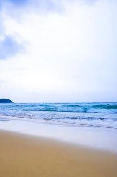 Dramatic dark storm clouds rain over tropical turquoise waves Kata Noi Beac.. Stock Photos