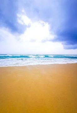 Dramatic dark storm clouds rain over tropical turquoise waves Kata Noi Beac.. Stock Photos