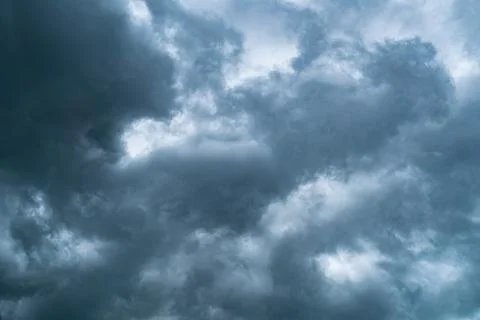 Dramatic dark storm clouds in the sky before rain. Stock Photos