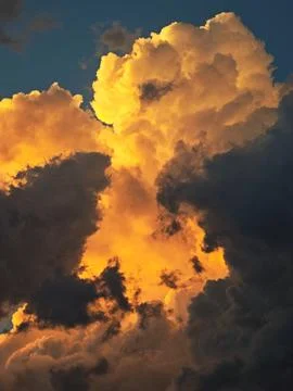 Dramatic dark storm clouds at sunset, a symbol of climate change and enviro.. Stock Photos
