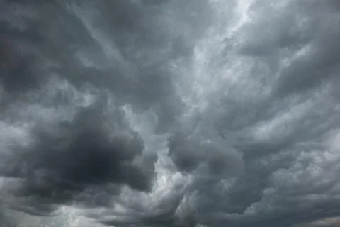 A dramatic dark storm cloudy sky or cloudscape.  Wide-angle view, gray clouds Photos