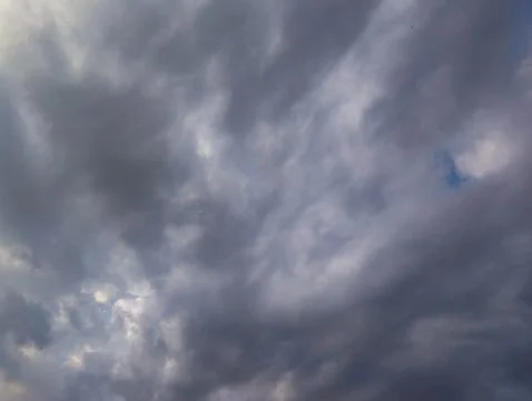 Dramatic dark stormy clouds covering the sky before rain. 写真素材
