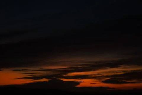 Dramatic Dark Sunset Sky with Clouds Stock Photos