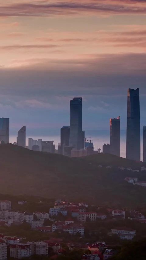 Dramatic Dawn: Qingdao City and Mountains Bathed in Golden Light Stock Footage 330742500