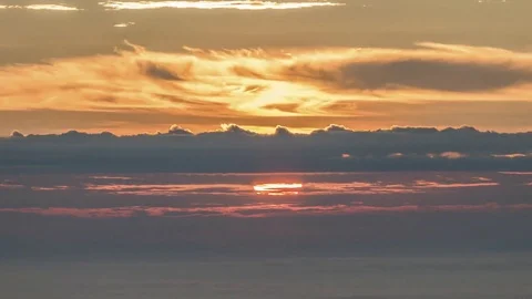 Dramatic dawn sky sunrise timelapse through flowing cloud wave, 4K Time lapse Stock Footage 83671375