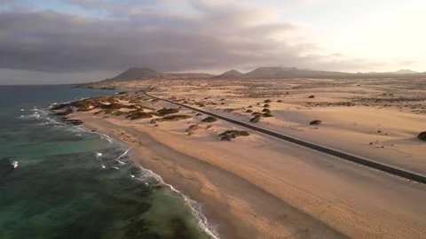 Dramatic desert landscape of Corralejo dunes in Fuerteventura at sunset. Aerial 動画素材 346654853
