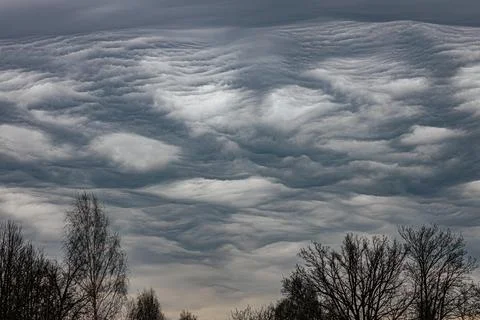 A dramatic display of undulatus asperatus clouds forms wavy Stock Photos