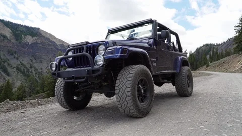 Dramatic Dolly Zoom Paradox Effect shot of a metallic purple Jeep vehicle, Stock Footage 100528898