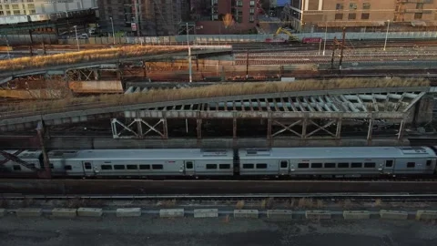 Dramatic drone angle of the Commuter trains in Long Island City 動画素材 144841320