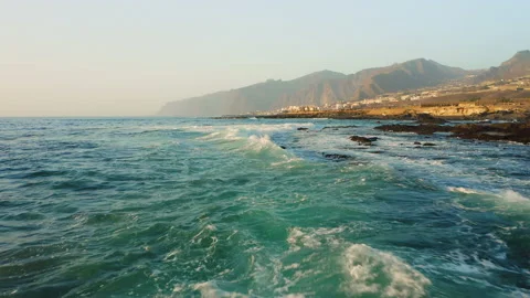 Dramatic drone fly over ocean surface waves splash foaming in stormy weather Stock Footage 221567632