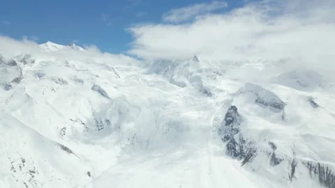 Dramatic Drone Footage of Snow-Capped Mountains in Gornergrat Stock Footage 287380036