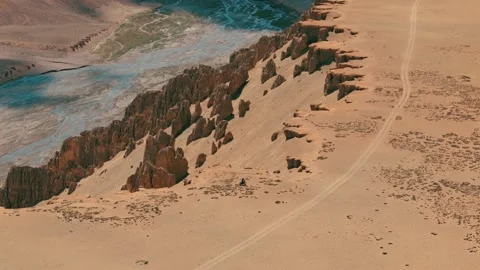 Dramatic drone perspective of a motorcycle journey in the grand canyon region of Stock Footage 310899082
