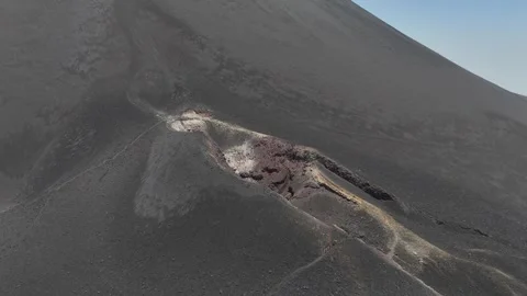 Dramatic drone perspective of a volcanic crater vent on the flank of Fogo Stock Footage 334968724