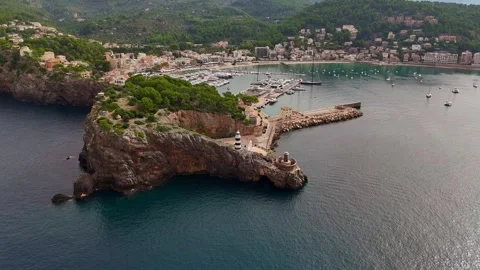 Dramatic Drone Pullback Over Sa Creu Lighthouse and Port de Sóller, Mallorca Stock Footage 305276892