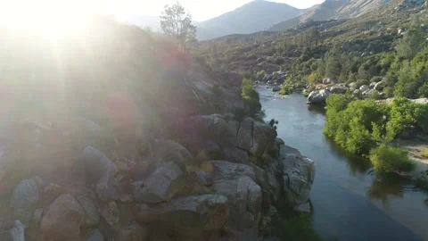 Dramatic Drone push in shot western mountains and river magic hour California Stock Footage 232085993