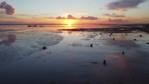 Dramatic drone shot of boats at low tide at Southend on Sea and sunset Stock Footage 165328050