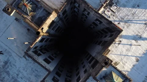 Dramatic drone shot falling and spinning into a shaft 動画素材 144707422