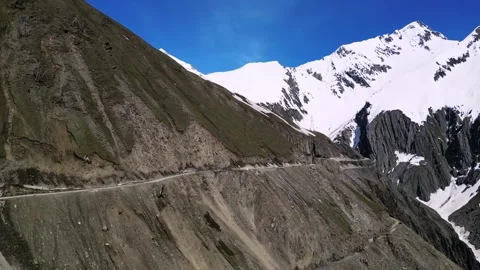 Dramatic drone sweep of Zojila Pass with sharp turns and steep drops. Stock Footage 310806678