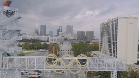 Dramatic Drone from traffic fly over Olympic Rings Tilt down Stock Footage 82441599