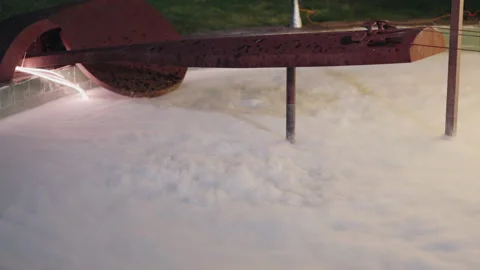 Dramatic dry ice effect creating mist over water with industrial textures Stock Footage 273694448