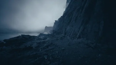 Dramatic dusk scene featuring foggy cliffs and distant headland atmosphere 스톡 동영상 331522132