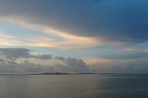 Dramatic Dusk Sky Over Calm Sea with Island Silhouette, Xiamen China Stock Photos