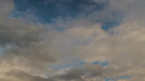 Dramatic dusk sky with towering clouds. Layers of gray and deep blue roll slowly Stock Footage 323437351