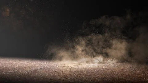 Dramatic dust and smoke cloud rising from a textured ground surface against.. Stock Photos