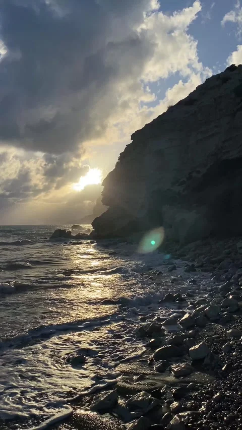 Dramatic early sunset at the beach with rocks Stock Footage 255797943