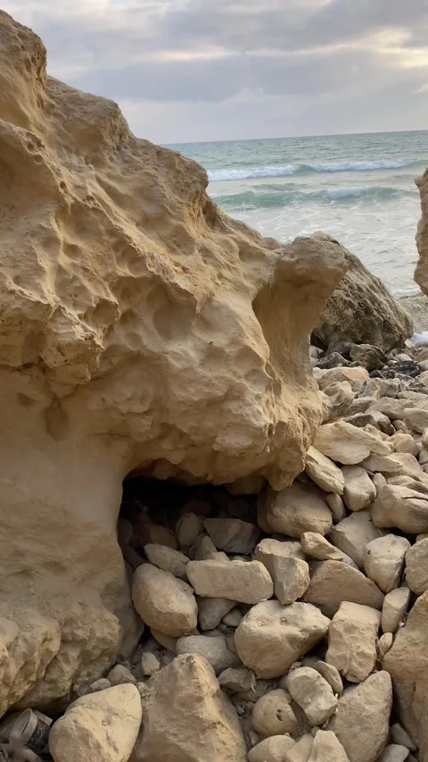 Dramatic early sunset at the beach with rocks Stock Footage 255798966