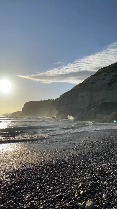 Dramatic early sunset at the beach with rocks Stock Footage 255799386
