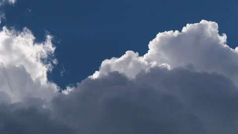 Dramatic Edge-Lit Cumulus Clouds Timelapse Stock Footage 317819778