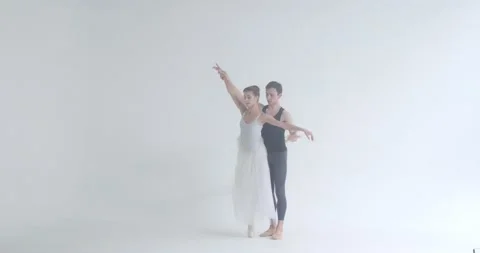 Dramatic elegant couple of classical ballet dancers rehearsing a dance, romantic Stock Footage 143525386