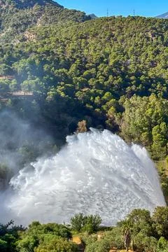 Dramatic emergency water release cascading from a reservoir 스톡 사진