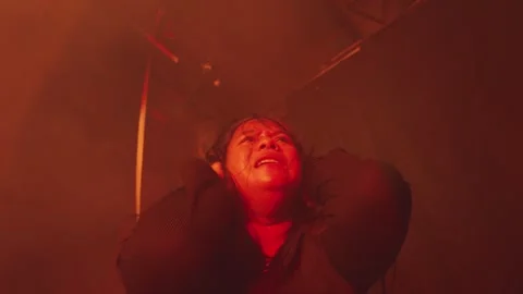 Dramatic Emotional Moment in Red Haze Stock Footage 296545652