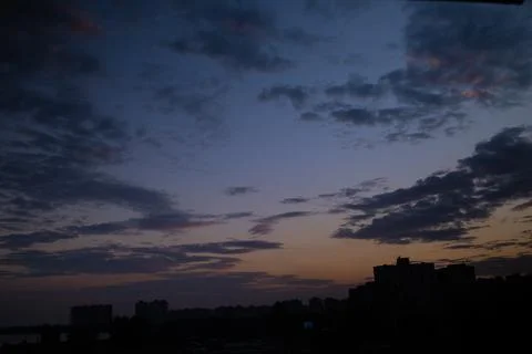 Dramatic evening cloud landscape in the city Stock Photos