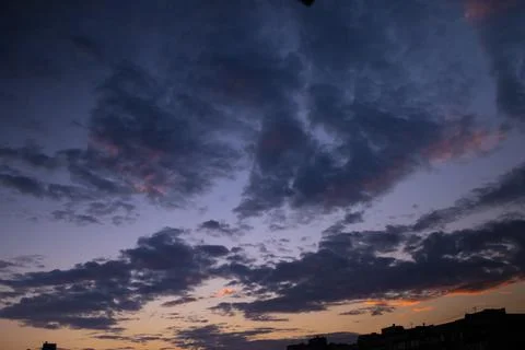Dramatic evening cloud landscape in the city Stock Photos