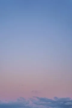 Dramatic Evening Pastel colored sky with clouds and copyspace Stock Photos