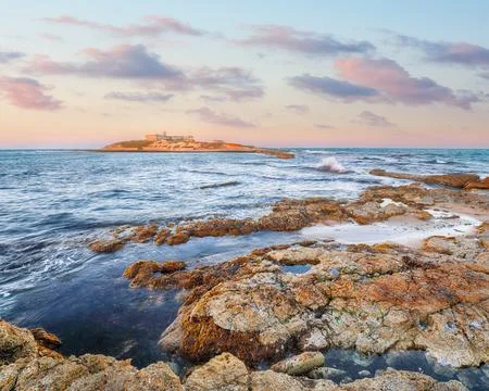 Dramatic evening scene of awesome spring seascape on the Passero cape Sicily. Stock Photos
