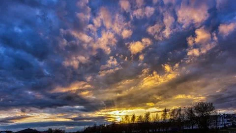 Dramatic evening sky with clouds in spring Stock Photos