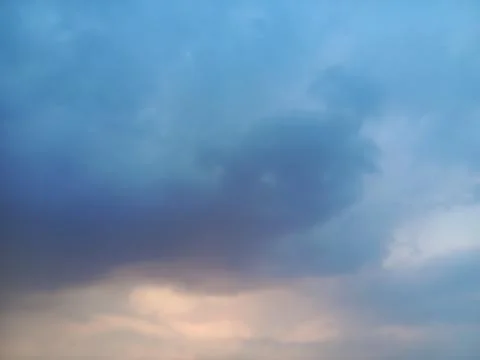 Dramatic Evening Sky With Dark Blue Clouds And Soft Sunset Light Stock Photos