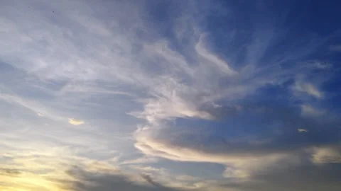 Dramatic Evening Sky with Golden and Blue Clouds at Sunset Stock Footage 309840556