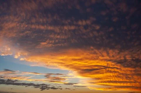 Dramatic Evening Sky with Golden Clouds Stock Photos