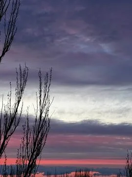 Dramatic Evening Sky Highlights Serene Landscape Stock Photos