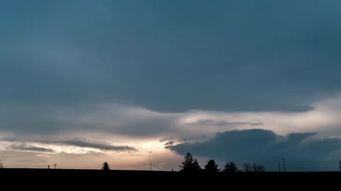 Dramatic Evening Sky with Silhouetted Trees Stock Footage 303867238
