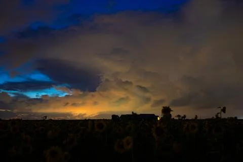 Dramatic Evening Sky with Vibrant Illuminated Clouds Stock Photos