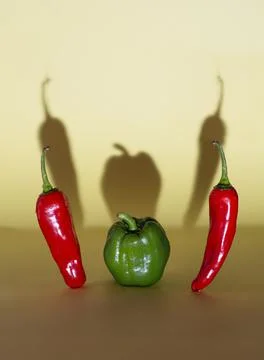 Dramatic evil Picture of chilli and capsicum ( Peppers ) with shadow falling Foto stock